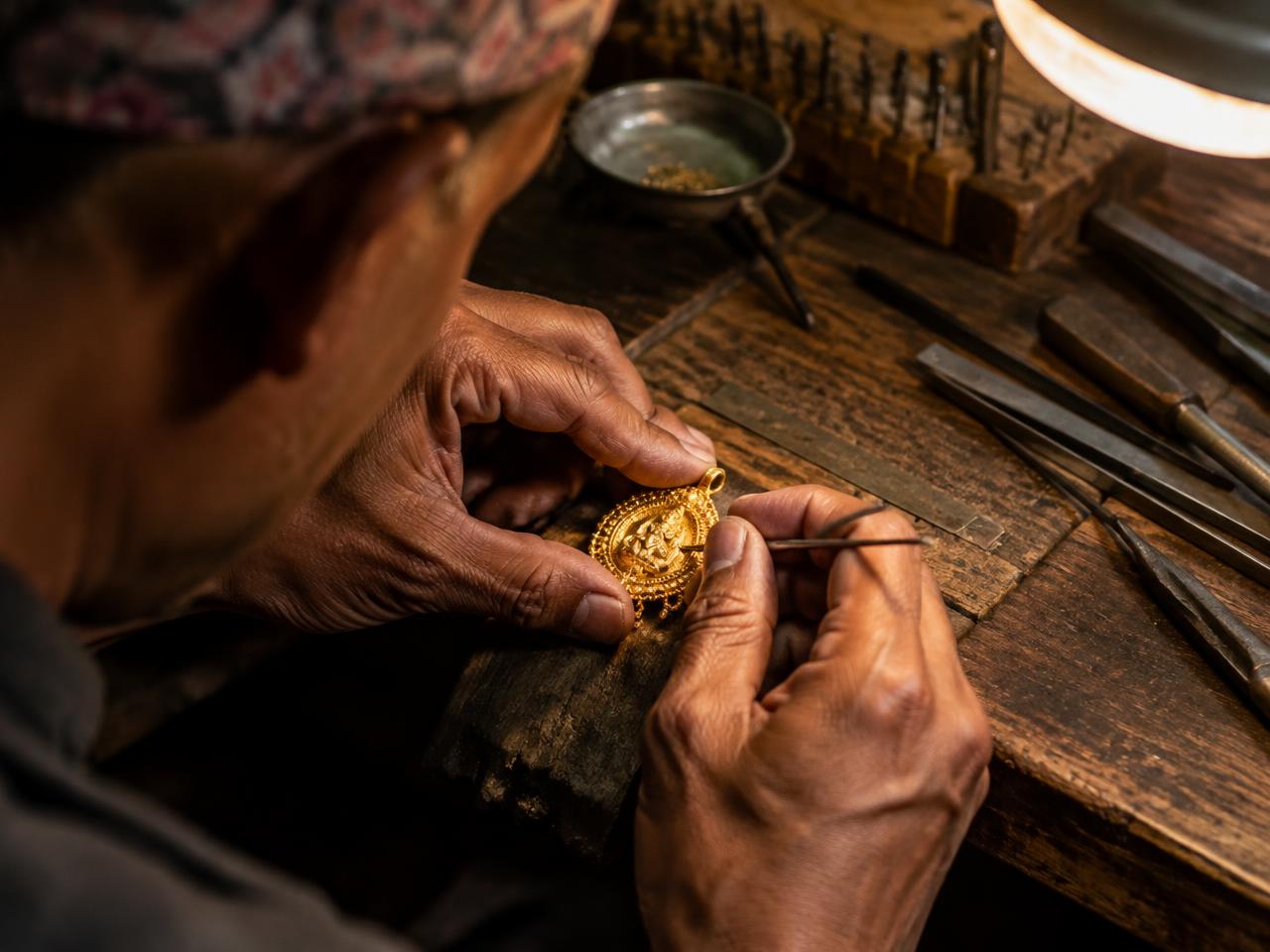 Goldsmith crafting a pendant